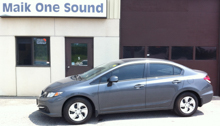 Grey Honda Civic with professional window tint at Maik One Sound