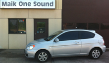 Kia vehicle with professional window tint in North Bay